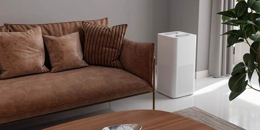 Air purifier next to couch